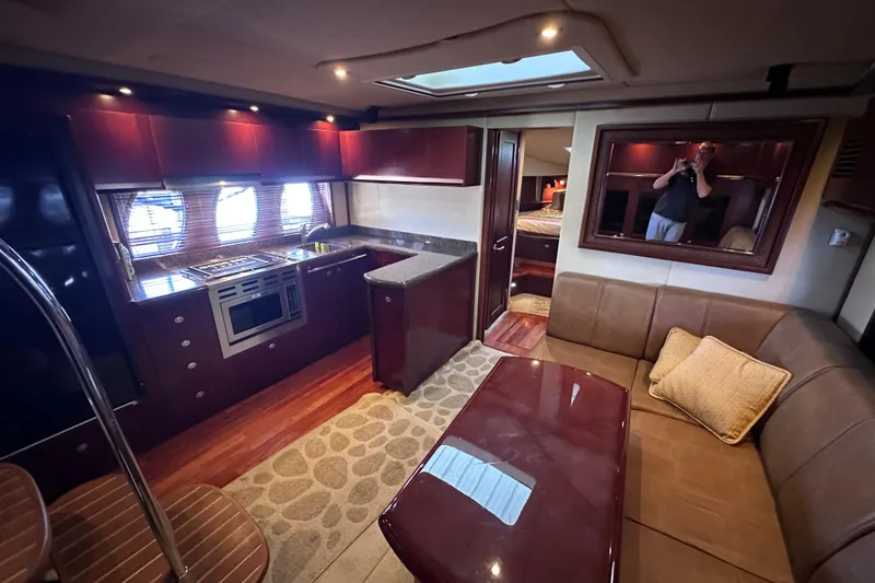 Slide: The Image of Luxurious interior of 2005 Sea Ray 48 Sundancer yacht with plush seating and modern amenities. - 20