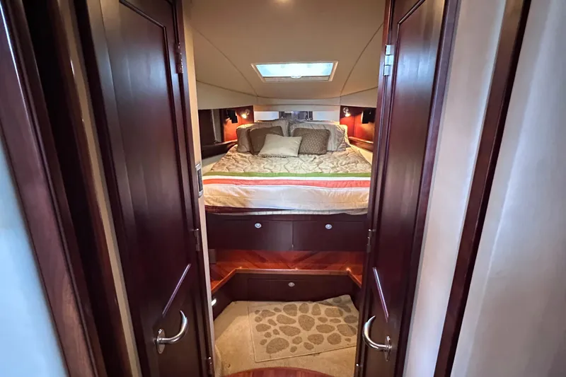 Slide: The Image of Luxurious interior of 2005 Sea Ray 48 Sundancer yacht with elegant seating and helm. - 23
