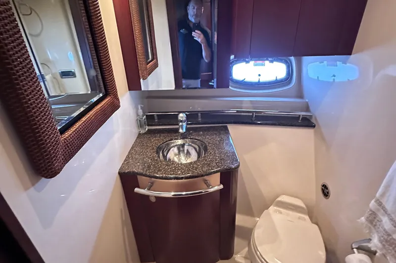 Slide: The Image of Luxurious interior of 2005 Sea Ray 48 Sundancer yacht with plush seating and entertainment area. - 24