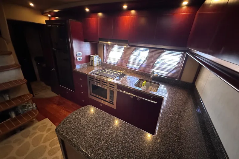 Slide: The Image of Luxurious interior of 2005 Sea Ray 48 Sundancer yacht with seating and kitchenette. - 26