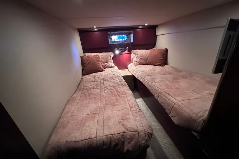 Slide: The Image of Luxurious 2005 Sea Ray 48 Sundancer yacht interior with elegant seating and wooden table. - 28