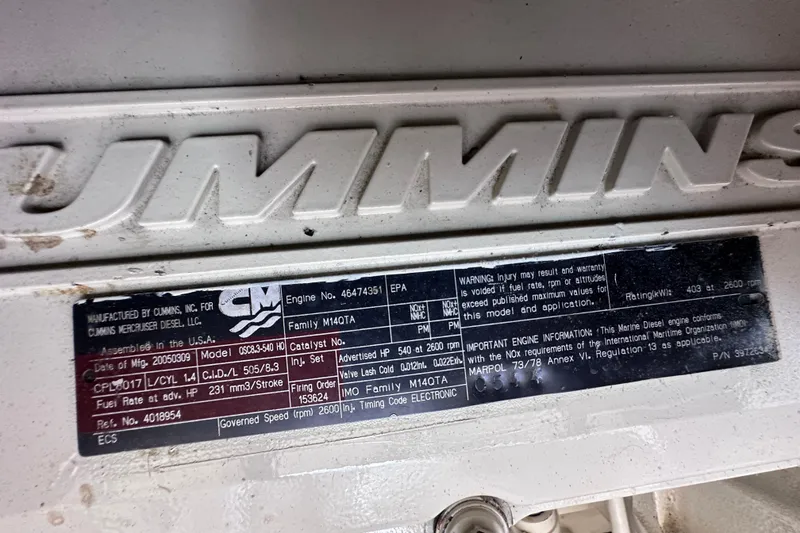 Slide: The Image of Luxurious interior of 2005 Sea Ray 48 Sundancer yacht with leather seating and wooden accents. - 34