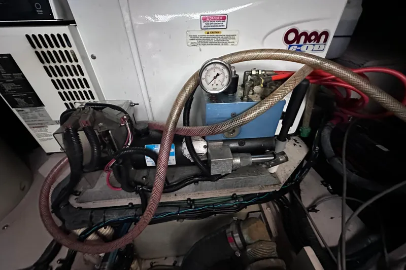 Slide: The Image of Luxurious 2005 Sea Ray 48 Sundancer cabin interior with cozy bed and elegant wood finishes. - 37