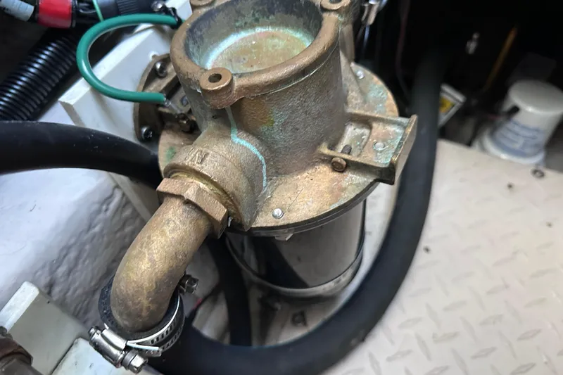 Slide: The Image of Engine compartment of a 2005 Sea Ray 48 Sundancer yacht, showcasing detailed machinery. - 48