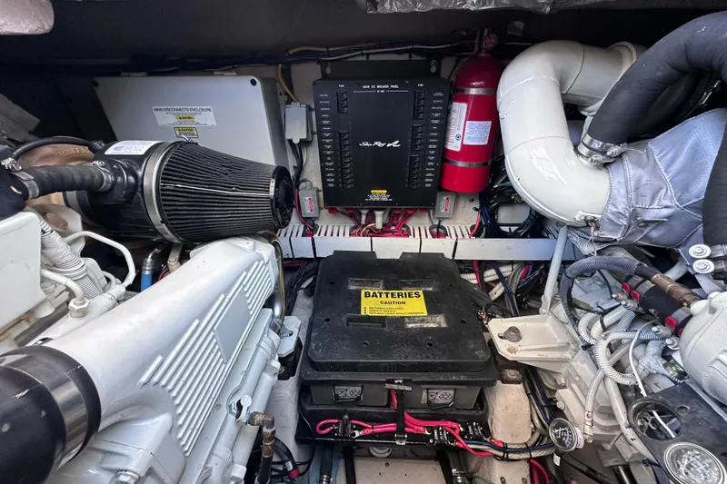 Slide: The Image of Engine room of 2005 Sea Ray 48 Sundancer with Onan generator and mechanical components. - 52