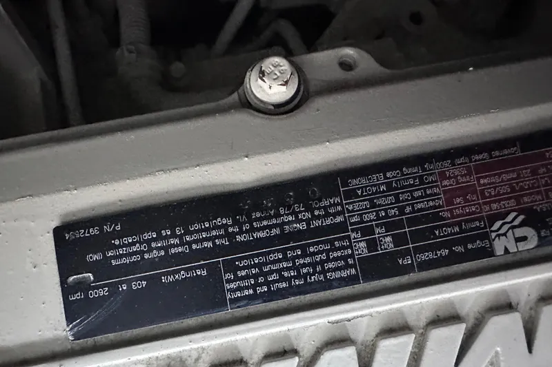 Slide: The Image of Engine label of a 2005 Sea Ray 48 Sundancer boat, displaying technical specifications. - 57