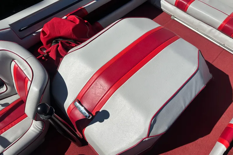 Slide: The Image of 1987 MasterCraft ProStar 190 interior with red and white upholstery, featuring a sleek design. - 10