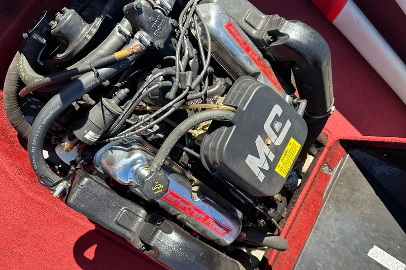Slide: The Image of Engine of a 1987 MasterCraft ProStar 190 boat, showcasing detailed components and wiring. - 11