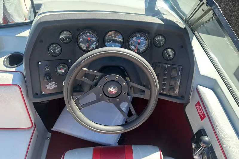 Slide: The Image of 1987 MasterCraft ProStar 190 dashboard with steering wheel and gauges. - 5