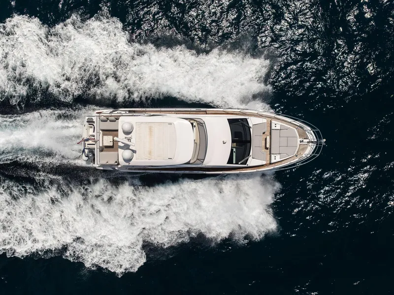 Slide: The Image of Azimut Fly 60 yacht cruising on open water, aerial view, 2022 model. - 12