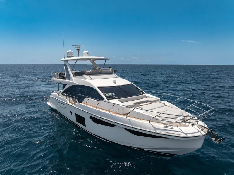 Slide: The Image of Azimut Fly 60 yacht cruising on open sea under clear blue sky, 2022 model. - 15