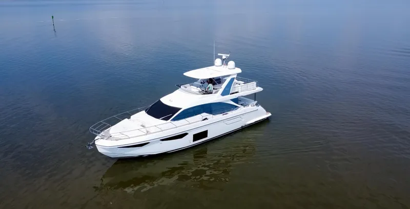 Slide: The Image of Azimut Fly 60 yacht, 2022 model, cruising on calm waters. - 20