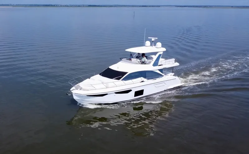 Slide: The Image of Azimut Fly 60 yacht cruising on calm waters, 2022 model. - 22