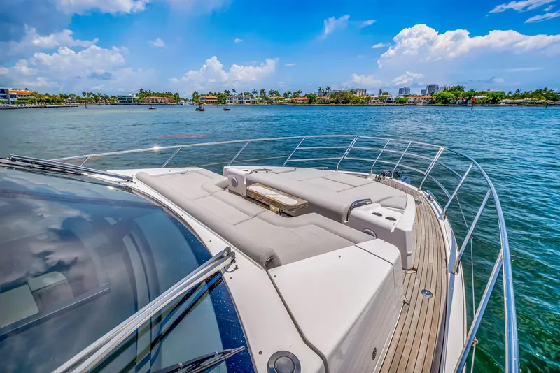 Slide: The Image of Azimut Fly 60 yacht, 2022 model, cruising on a sunny day with scenic waterfront views. - 29