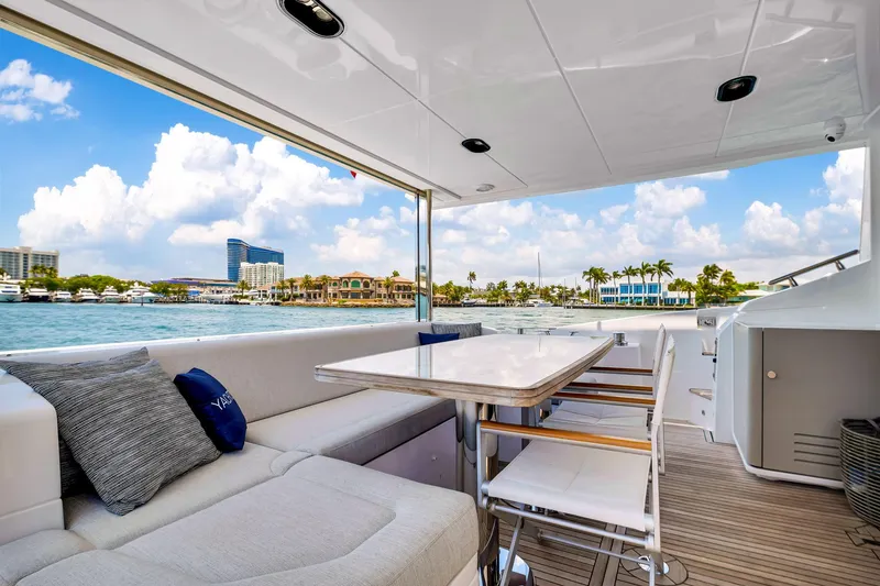 Slide: The Image of Luxurious 2022 Azimut Fly 60 yacht deck with seating and ocean view. - 33