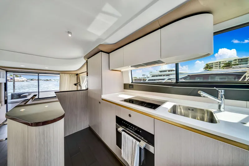 Slide: The Image of Modern kitchen interior of 2022 Azimut Fly 60 yacht with sleek design and waterfront view. - 44