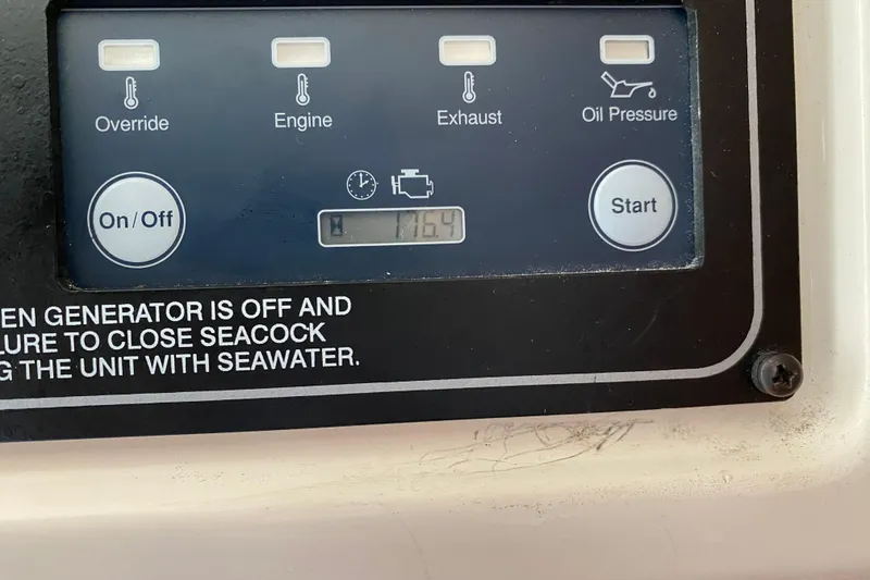 Slide: The Image of Control panel of a 2021 Grady-White Freedom 335 boat, showing engine and oil pressure indicators. - 10
