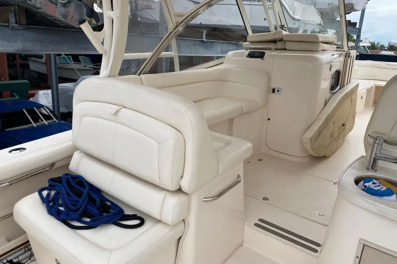Slide: The Image of 2021 Grady-White Freedom 335 boat interior with white seating and blue rope. - 14