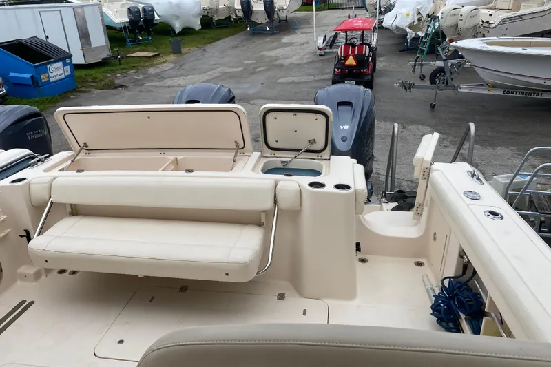 Slide: The Image of 2021 Grady-White Freedom 335 boat interior with seating and storage compartments. - 16