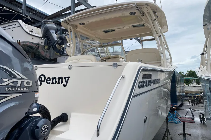 Slide: The Image of 2021 Grady-White Freedom 335 boat with XTO Offshore engine, docked and ready. - 18