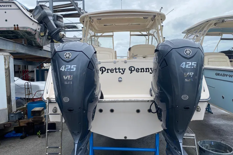 Slide: The Image of 2021 Grady-White Freedom 335 boat with twin Yamaha 425 V8 engines at dock. - 19