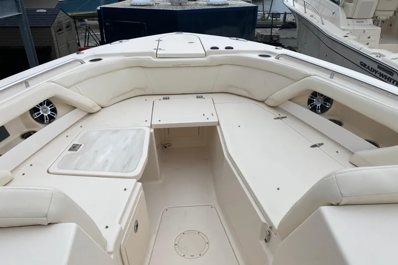 Slide: The Image of 2021 Grady-White Freedom 335 boat interior with spacious seating and storage compartments. - 3