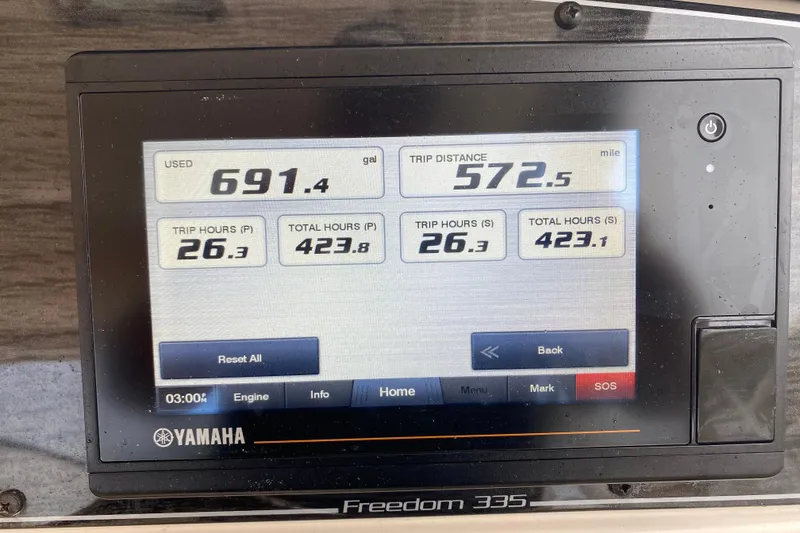 Slide: The Image of Yamaha display on 2021 Grady-White Freedom 335 showing fuel and trip data. - 6