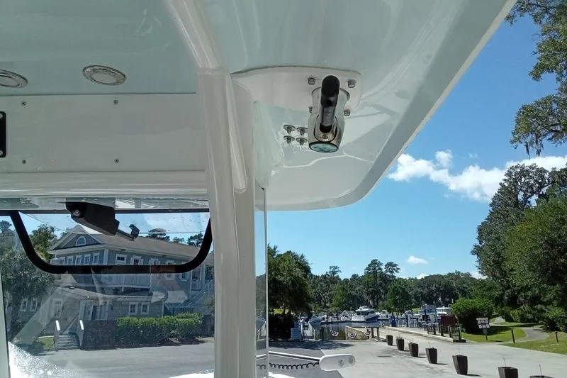Slide: The Image of 2019 Sea Hunt Ultra 255 SE boat interior with marina view. - 20