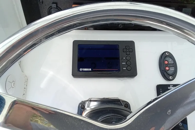 Slide: The Image of Steering console of 2019 Sea Hunt Ultra 255 SE with Yamaha display and controls. - 25