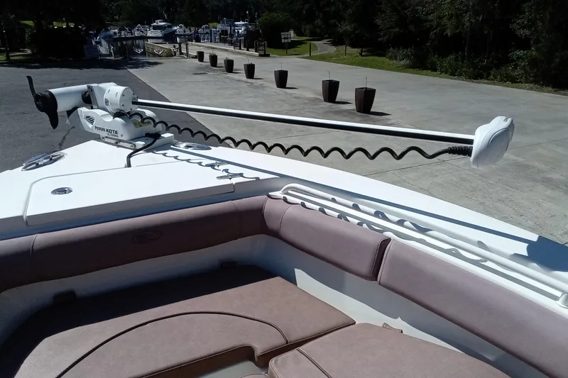 Slide: The Image of 2019 Sea Hunt Ultra 255 SE boat with Minn Kota trolling motor at dock. - 36