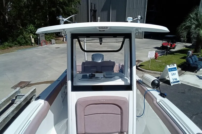 Slide: The Image of 2019 Sea Hunt Ultra 255 SE boat docked at marina, front view. - 40