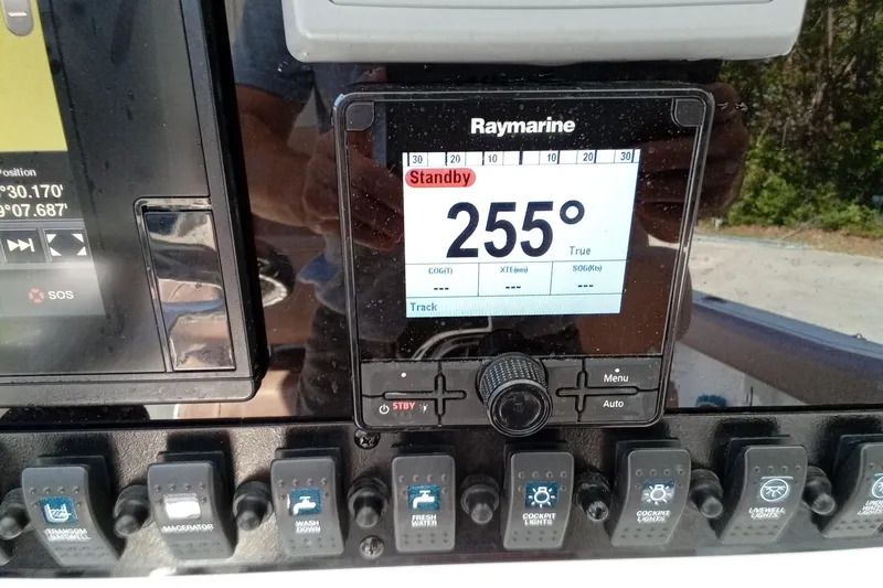 Slide: The Image of Control panel of a 2019 Sea Hunt Ultra 255 SE boat with Raymarine display. - 47