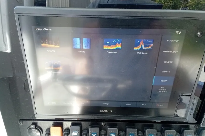 Slide: The Image of Garmin sonar display on 2019 Sea Hunt Ultra 255 SE boat dashboard. - 49