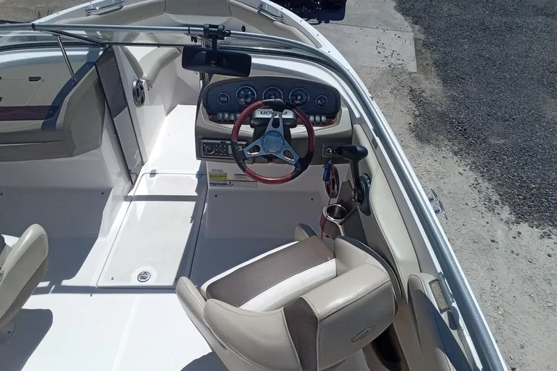 Slide: The Image of 2014 Regal 2000 Bowrider interior with steering wheel and dashboard controls. - 11