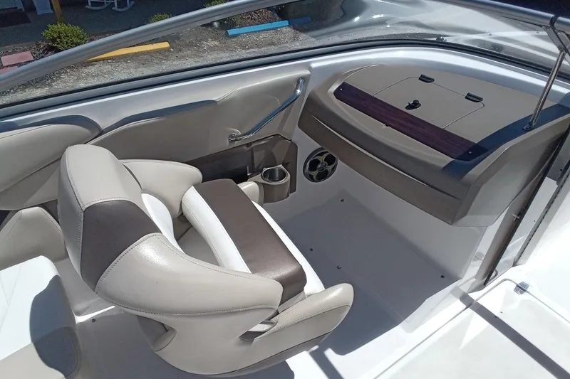 Slide: The Image of Interior of a 2014 Regal 2000 Bowrider boat with beige and brown seating. - 12