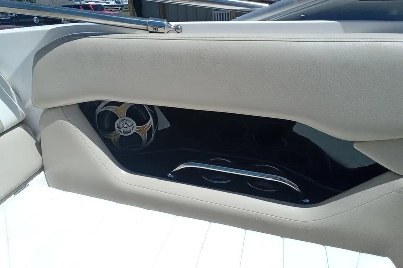 Slide: The Image of Interior of 2014 Regal 2000 Bowrider boat with speaker and beige upholstery. - 13