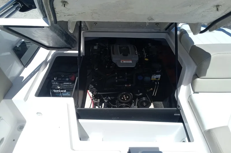 Slide: The Image of 2014 Regal 2000 Bowrider engine compartment with battery and seating area. - 20