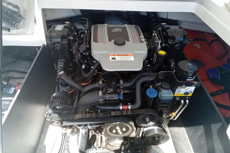 Slide: The Image of 2014 Regal 2000 Bowrider engine compartment showcasing a powerful inboard motor. - 21