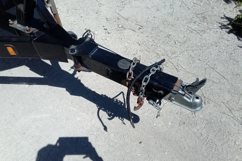 Slide: The Image of Trailer hitch of a 2014 Regal 2000 Bowrider on a gravel surface. - 5