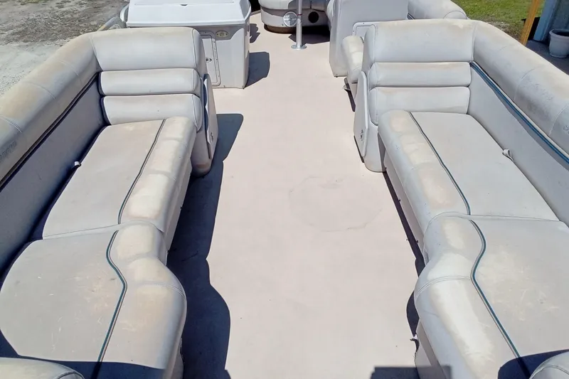 Slide: The Image of 2003 Godfrey SANPAN 2500 pontoon boat interior with spacious seating and storage. - 11