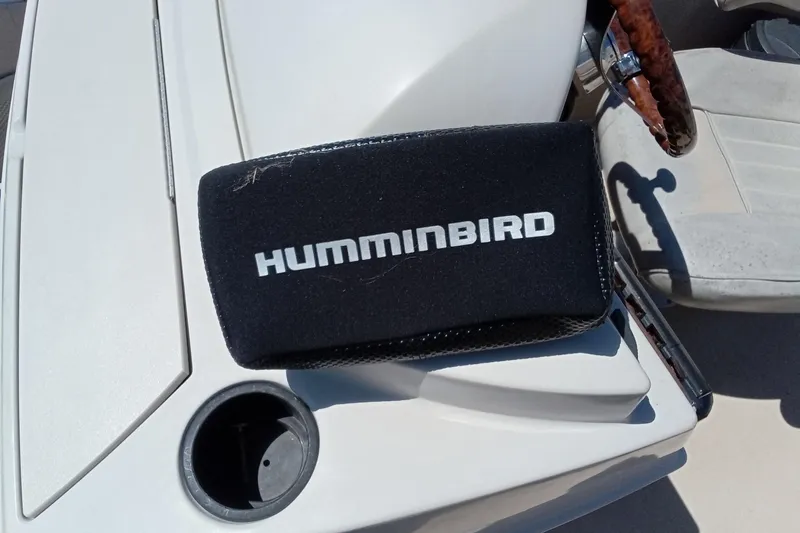 Slide: The Image of Humminbird device on 2003 Godfrey SANPAN 2500 boat dashboard with cup holder. - 22