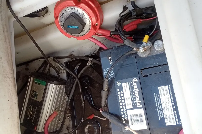 Slide: The Image of Battery and wiring setup in a 2003 Godfrey SANPAN 2500 boat. - 27