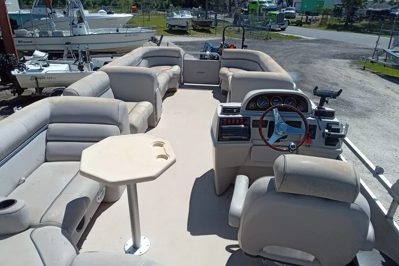 Slide: The Image of 2003 Godfrey SANPAN 2500 pontoon boat interior with seating and steering console. - 28