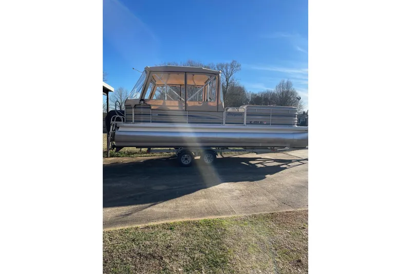 Slide: The Image of 2003 Godfrey SANPAN 2500 pontoon boat on trailer, sunny day, clear blue sky. - 33