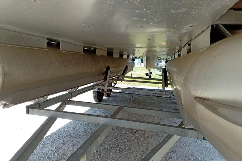 Slide: The Image of Underneath view of a 2003 Godfrey SANPAN 2500 pontoon boat on a trailer. - 6