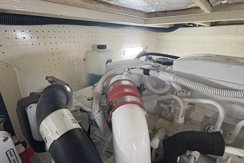 Slide: The Image of Open cooler on 1988 Egg Harbor 37 Convertible boat with drinks inside. - 11