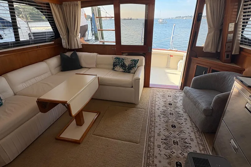 Slide: The Image of Luxurious interior of 1988 Egg Harbor 37 Convertible yacht with white leather seating. - 22