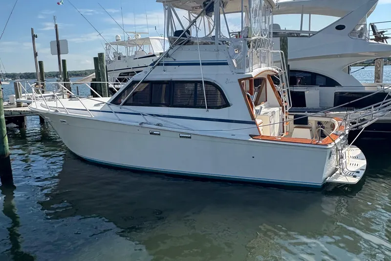 Slide: The Image of Bathroom interior of 1988 Egg Harbor 37 Convertible yacht, featuring wood cabinetry and modern fixtures. - 23