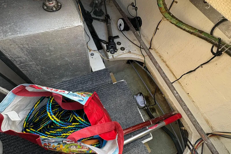 Slide: The Image of Cozy cabin interior of 1988 Egg Harbor 37 Convertible with nautical-themed bedding. - 27