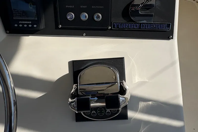 Slide: The Image of Cockpit view of 1988 Egg Harbor 37 Convertible with navigation screens at marina. - 30